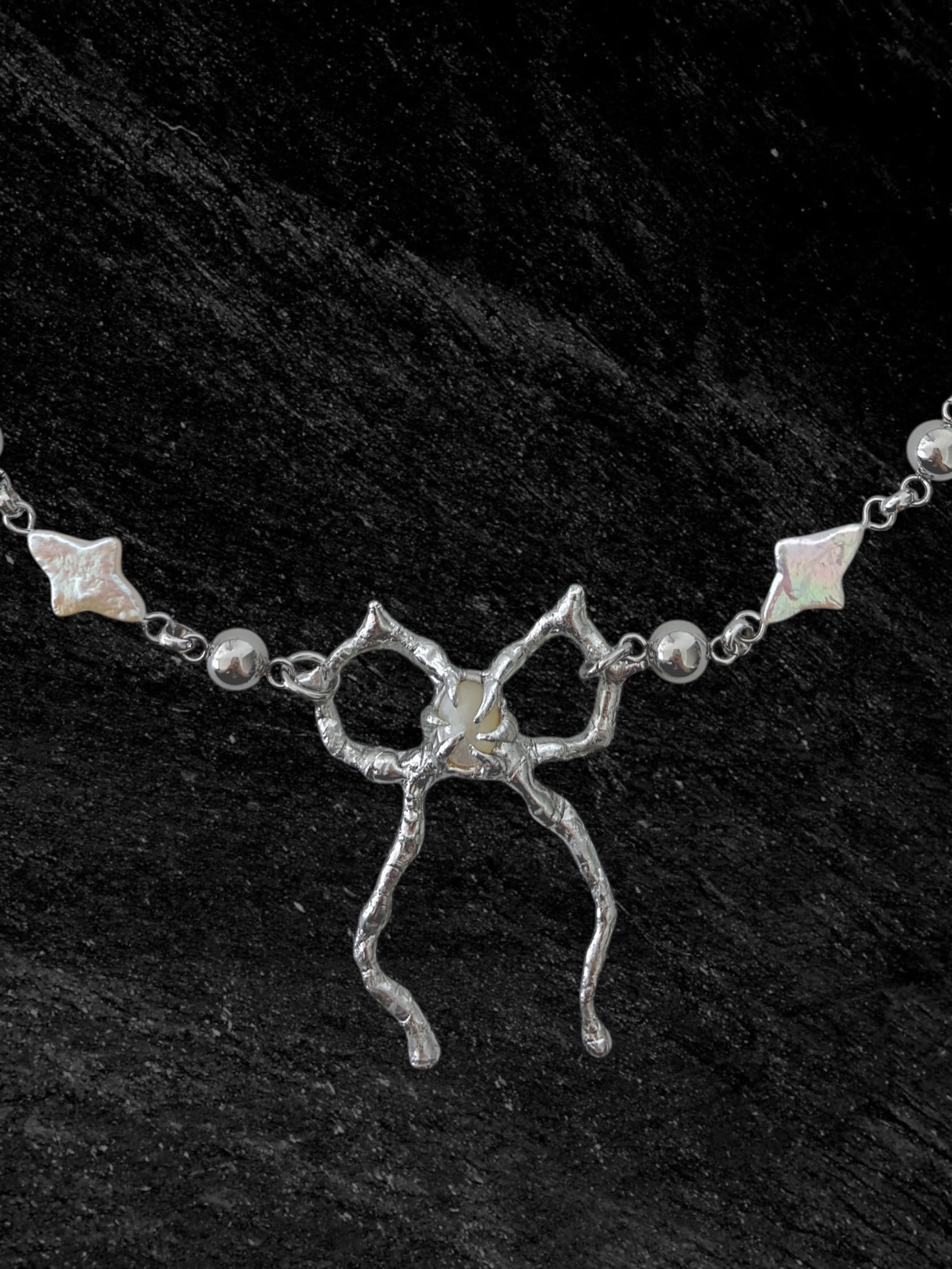 Spiky Bow and Pearl Necklace