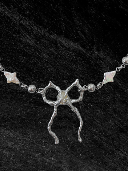 Spiky Bow and Pearl Necklace