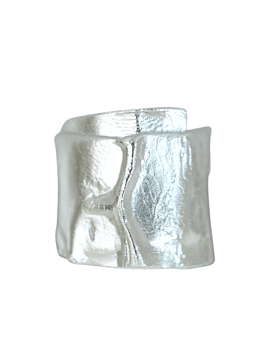 “Imprinta Ring by RABIES DOG, crafted in S925 sterling silver with a textured surface on a dark background.”