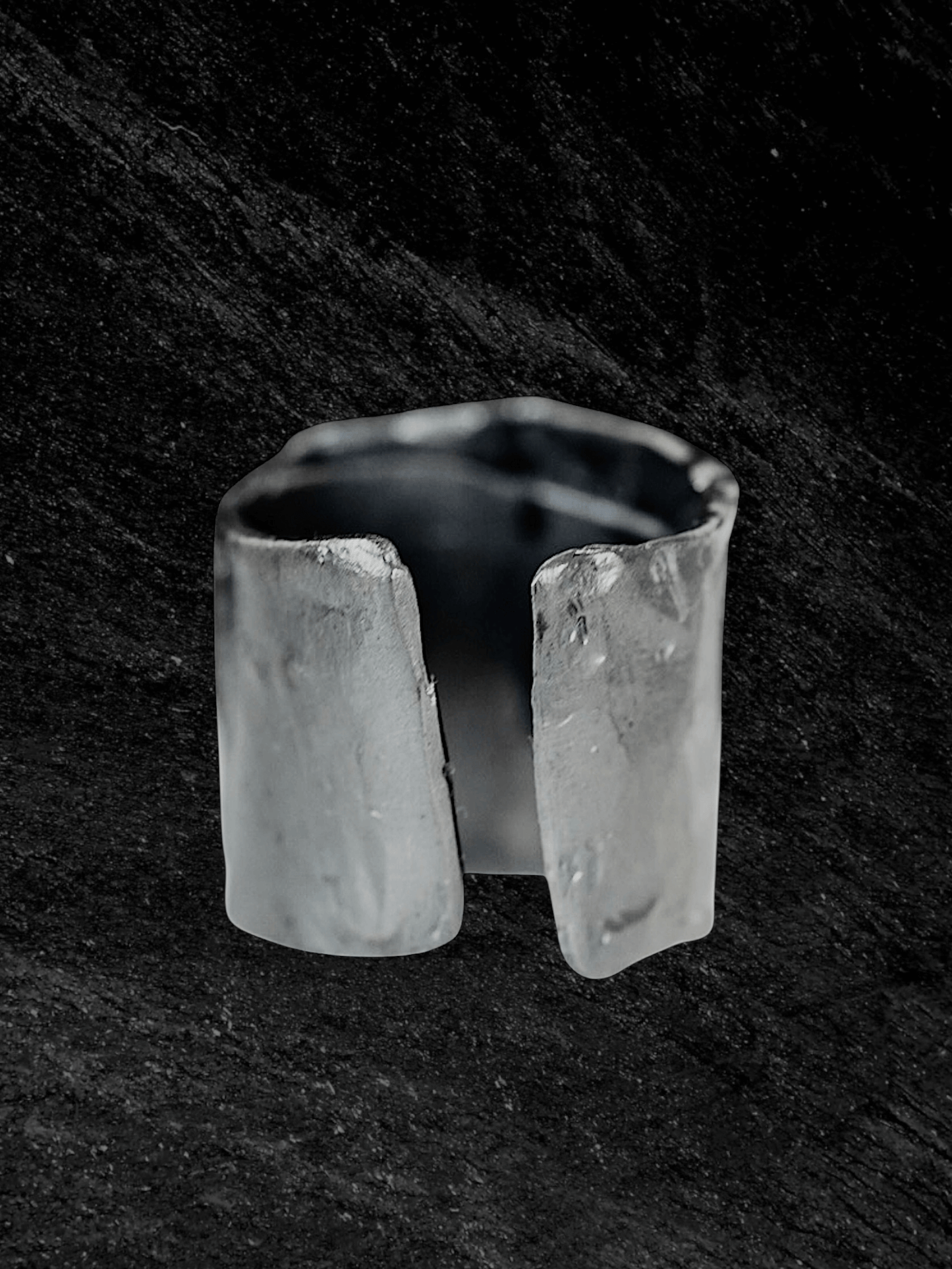 “Imprinta Ring by RABIES DOG, crafted in S925 sterling silver with a textured surface on a dark background.”