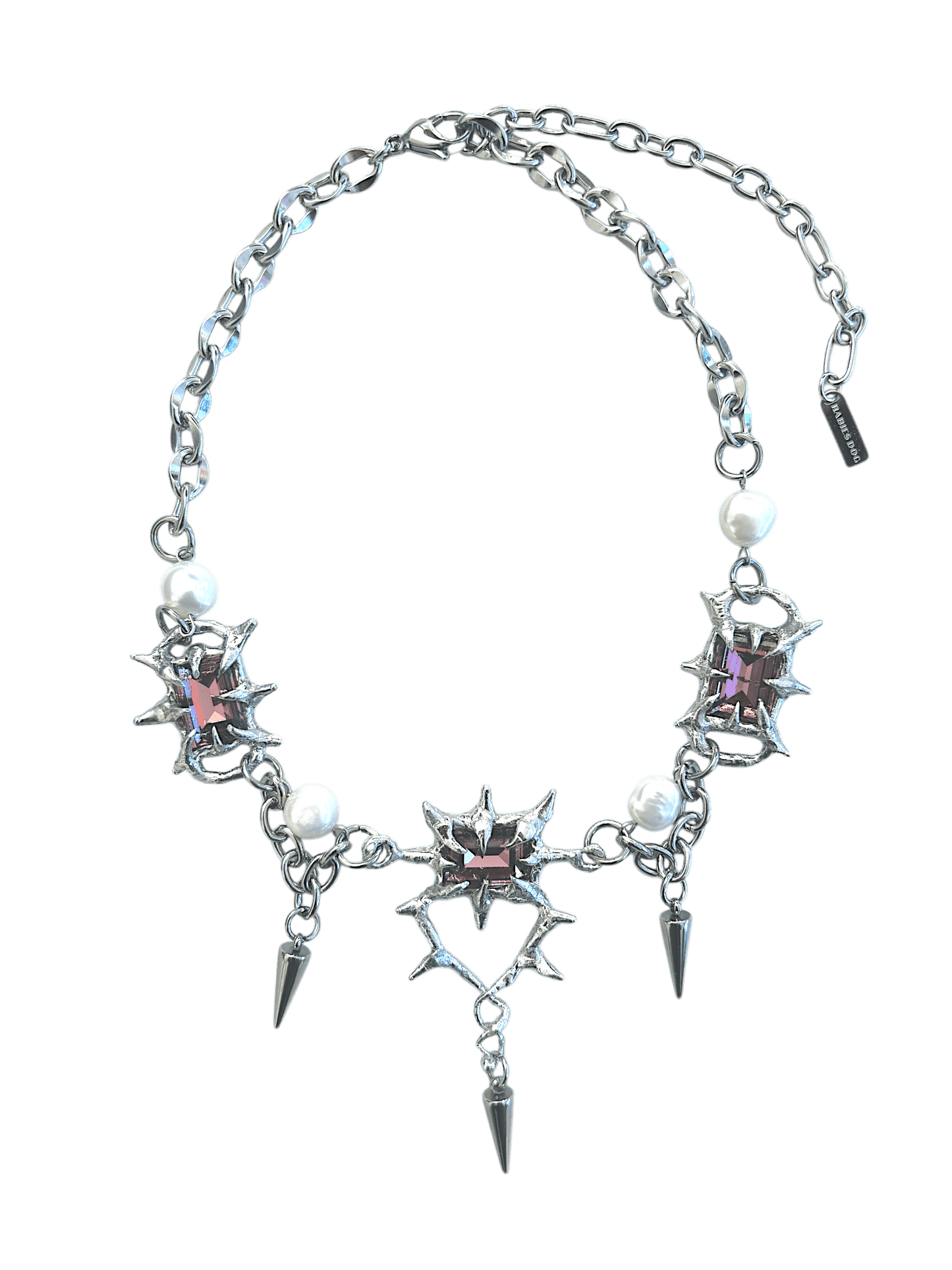 The Midnight Candelabrum Necklace is a sculptural statement piece inspired by gothic candleholders and nocturnal ritual objects. Handcrafted by RABIES DOG, this necklace carries a dark, altar-like presence—designed to be worn as both adornment and symbol.