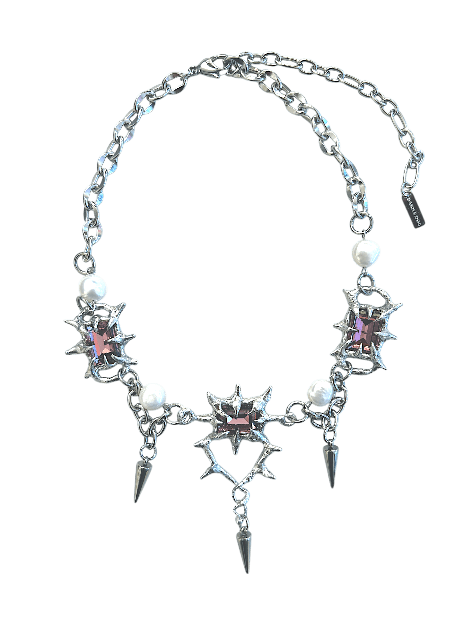 The Midnight Candelabrum Necklace is a sculptural statement piece inspired by gothic candleholders and nocturnal ritual objects. Handcrafted by RABIES DOG, this necklace carries a dark, altar-like presence—designed to be worn as both adornment and symbol.