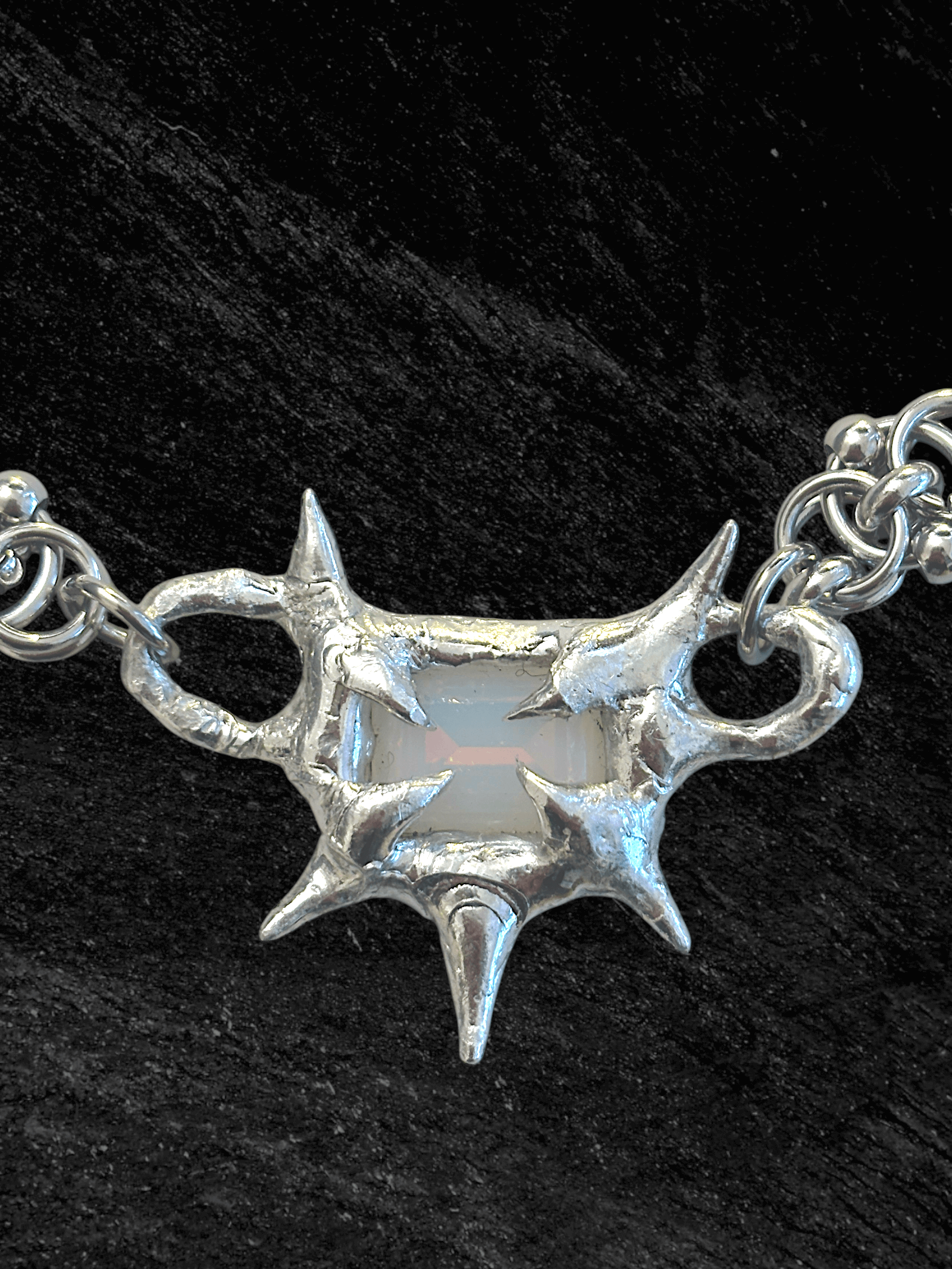 “Softlight Crystal Necklace by RABIES DOG, handcrafted with a soldered setting and a soft-glow crystal accent.”