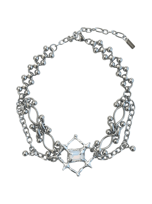 The Angel’s Eye Necklace is a sculptural statement piece inspired by sacred symbolism and watchful, otherworldly forms. Handcrafted by RABIES DOG, it carries a quiet tension between protection and unease