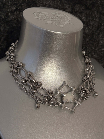 The Angel’s Eye Necklace is a sculptural statement piece inspired by sacred symbolism and watchful, otherworldly forms. Handcrafted by RABIES DOG, it carries a quiet tension between protection and unease