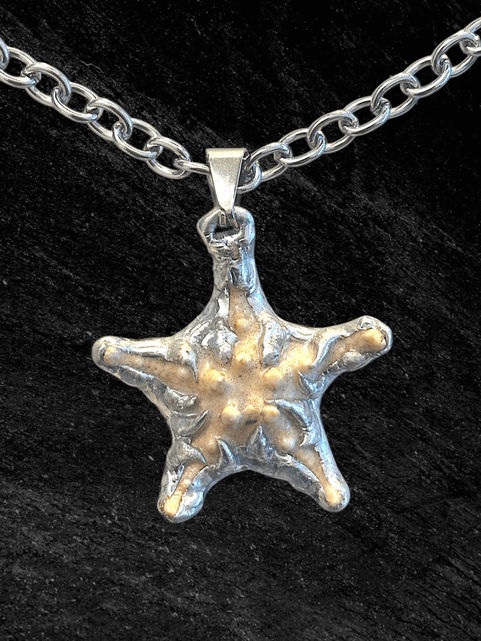 “Littlestarfish Necklace by RABIES DOG, featuring a real starfish, carefully soldered and UV sealed for preservation.”