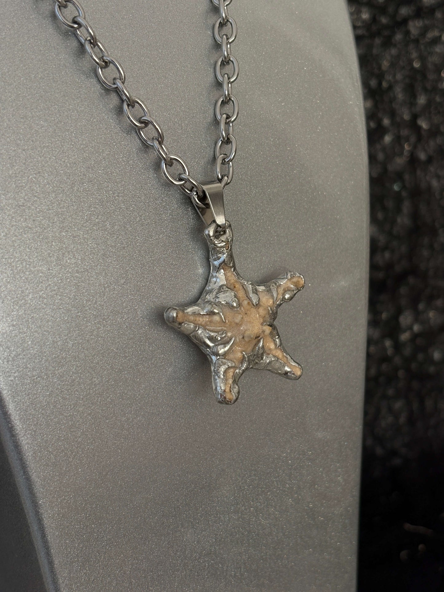 “Littlestarfish Necklace by RABIES DOG, featuring a real starfish, carefully soldered and UV sealed for preservation.”