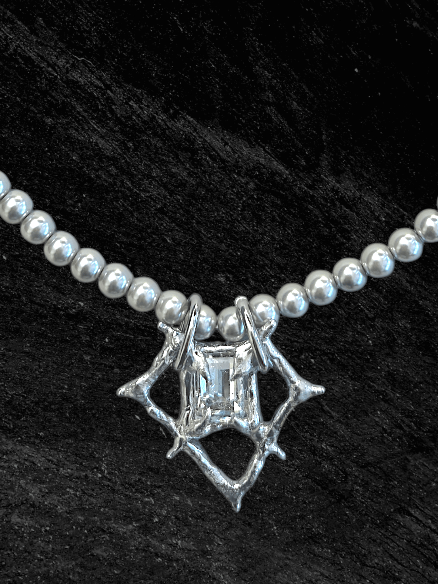 RABIES DOG Oracle necklace, a soldered crystal talisman worn on a pearl-like chain with an organic sculptural finish