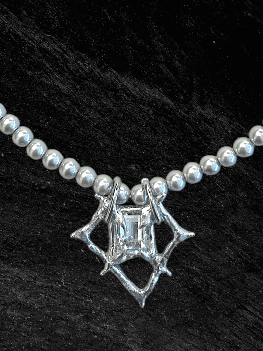 RABIES DOG Oracle necklace, a soldered crystal talisman worn on a pearl-like chain with an organic sculptural finish