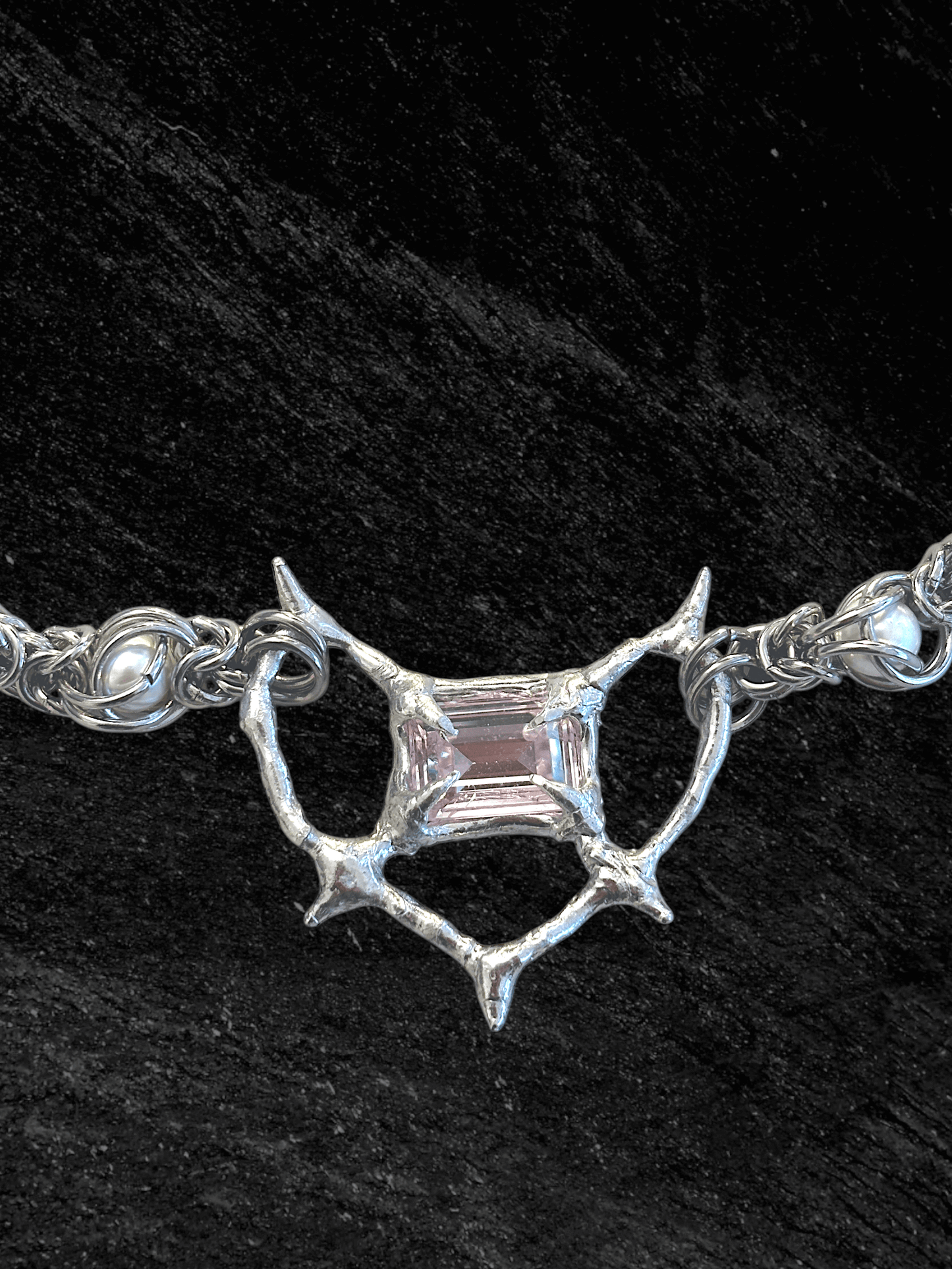 Pearl Antler necklace by RABIES DOG, handcrafted soldered metal necklace with pearls and organic antler-inspired form, front view on dark background