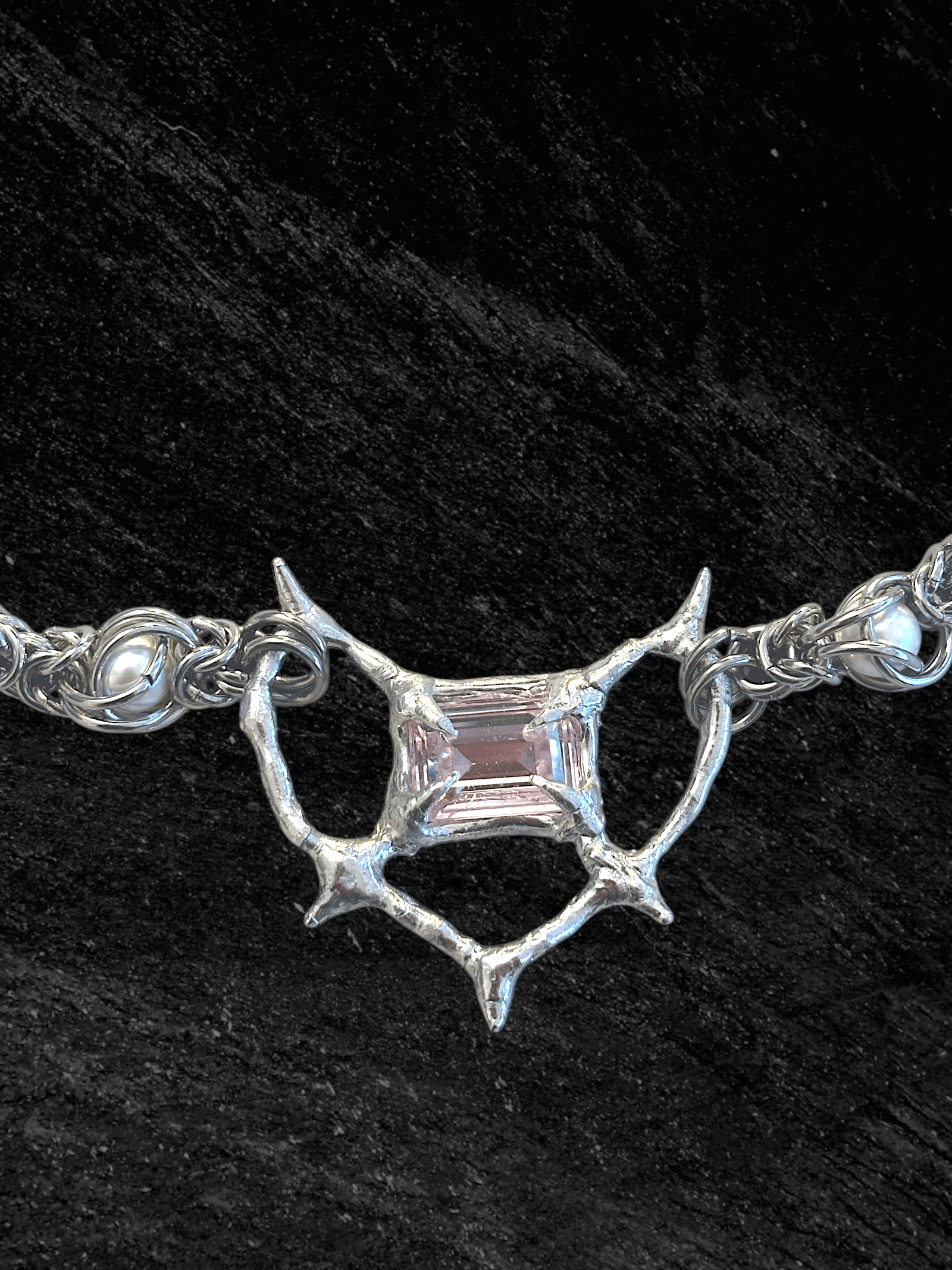 Pearl Antler necklace by RABIES DOG, handcrafted soldered metal necklace with pearls and organic antler-inspired form, front view on dark background