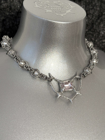 Pearl Antler necklace by RABIES DOG, handcrafted soldered metal necklace with pearls and organic antler-inspired form, front view on dark background