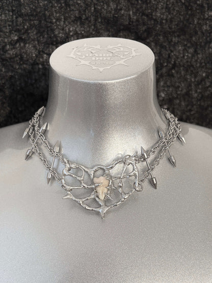 Tooth Fairy necklace by RABIES DOG, handcrafted soldered metal necklace designed for customization using customer-provided wisdom tooth or bone.